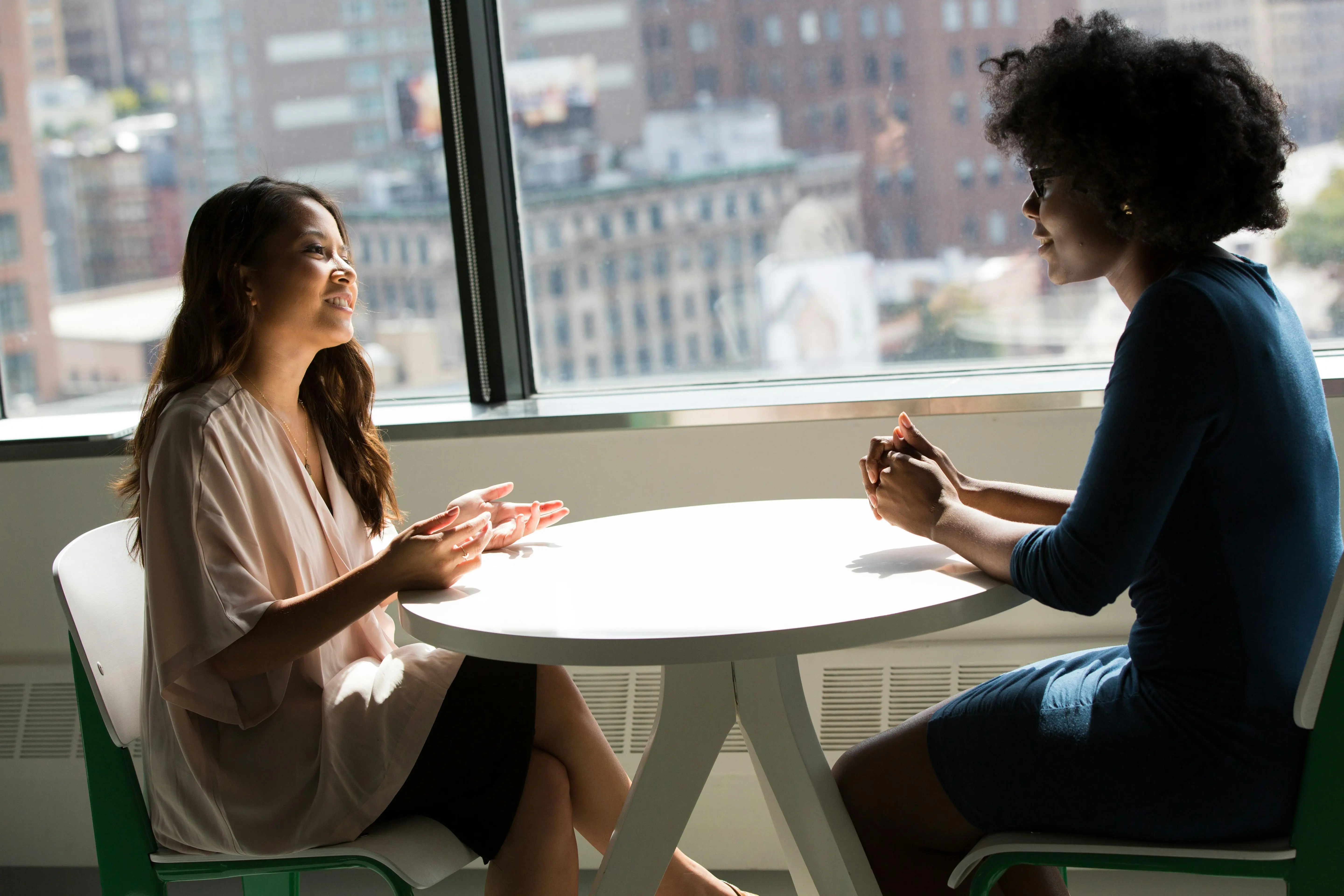 Photo of women talking at a table
